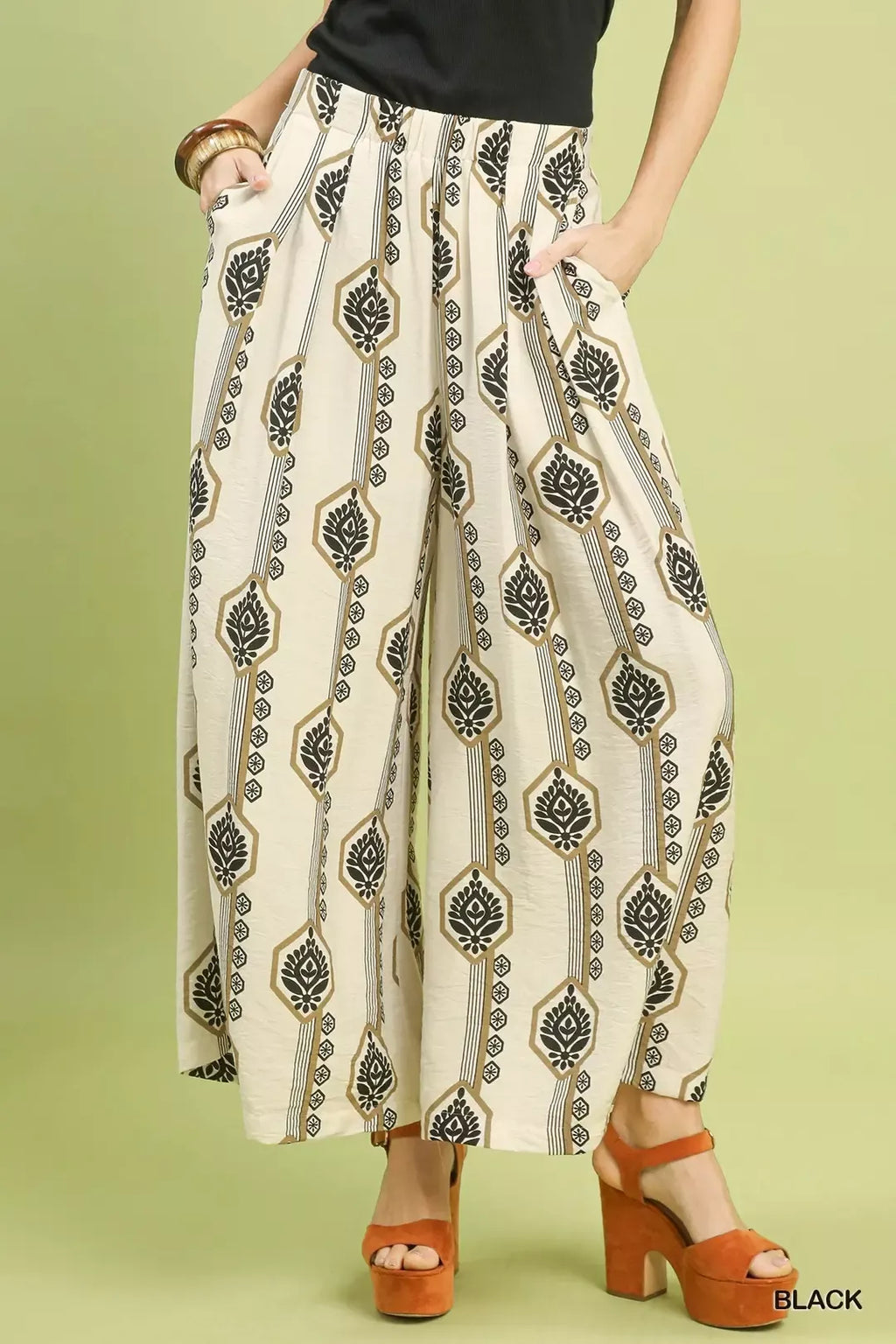 Wide-leg boho pants in cream with black geometric print, elastic waist and drawstring tie