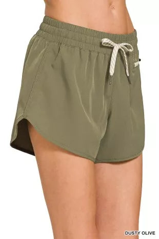 Dusty olive woven lined shorts, elastic waistband with drawstring, side zip coin pocket
