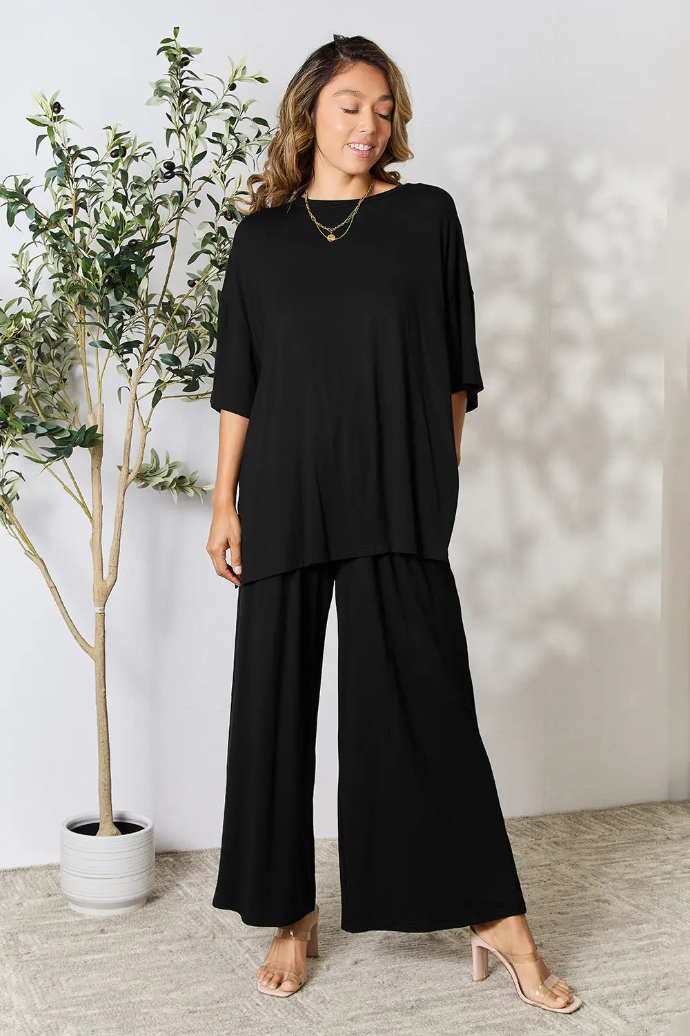 Black tunic set: round-neck top with side slits and wide-leg pants
