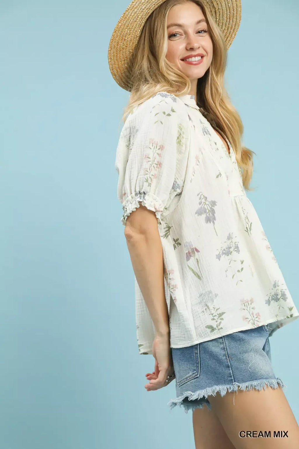 Cream mix floral gauze top with puff sleeves, elastic cuffs, and V-neck