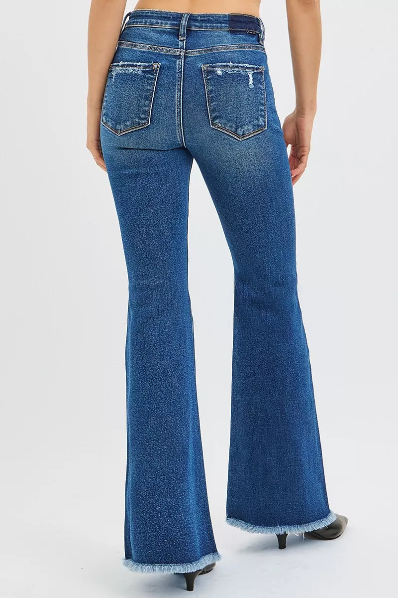 High-rise flare jeans back view in dark wash denim with five-pocket design and belt loops.