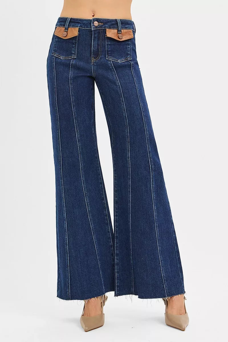 High-rise wide flare jeans in dark blue with front leather pocket detail