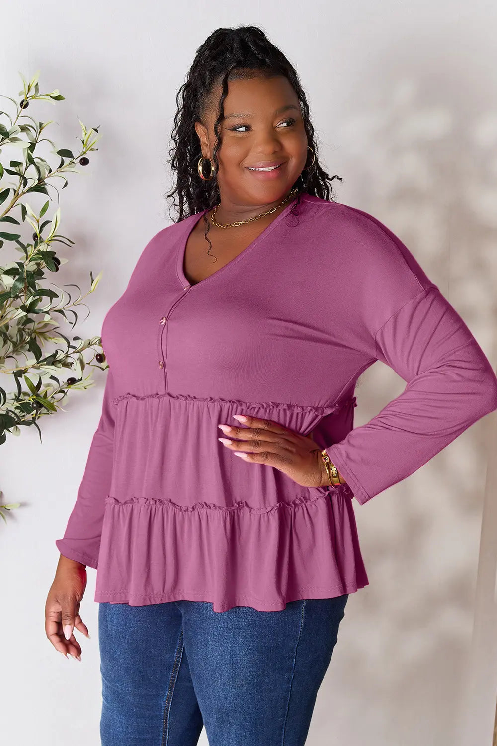 Lilac long-sleeve blouse with half-button V-neck and tiered ruffle hem