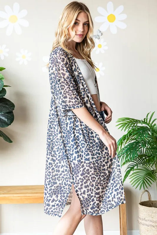 Side view of taupe leopard print open-front cardigan with short sleeves, midi length