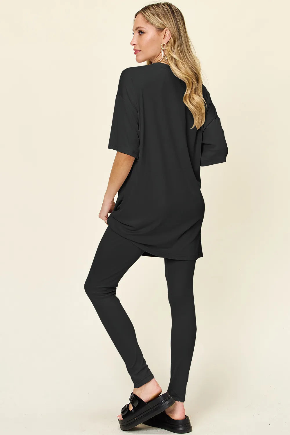 Black tunic T-shirt and slim leggings set with round neck and dropped sleeves