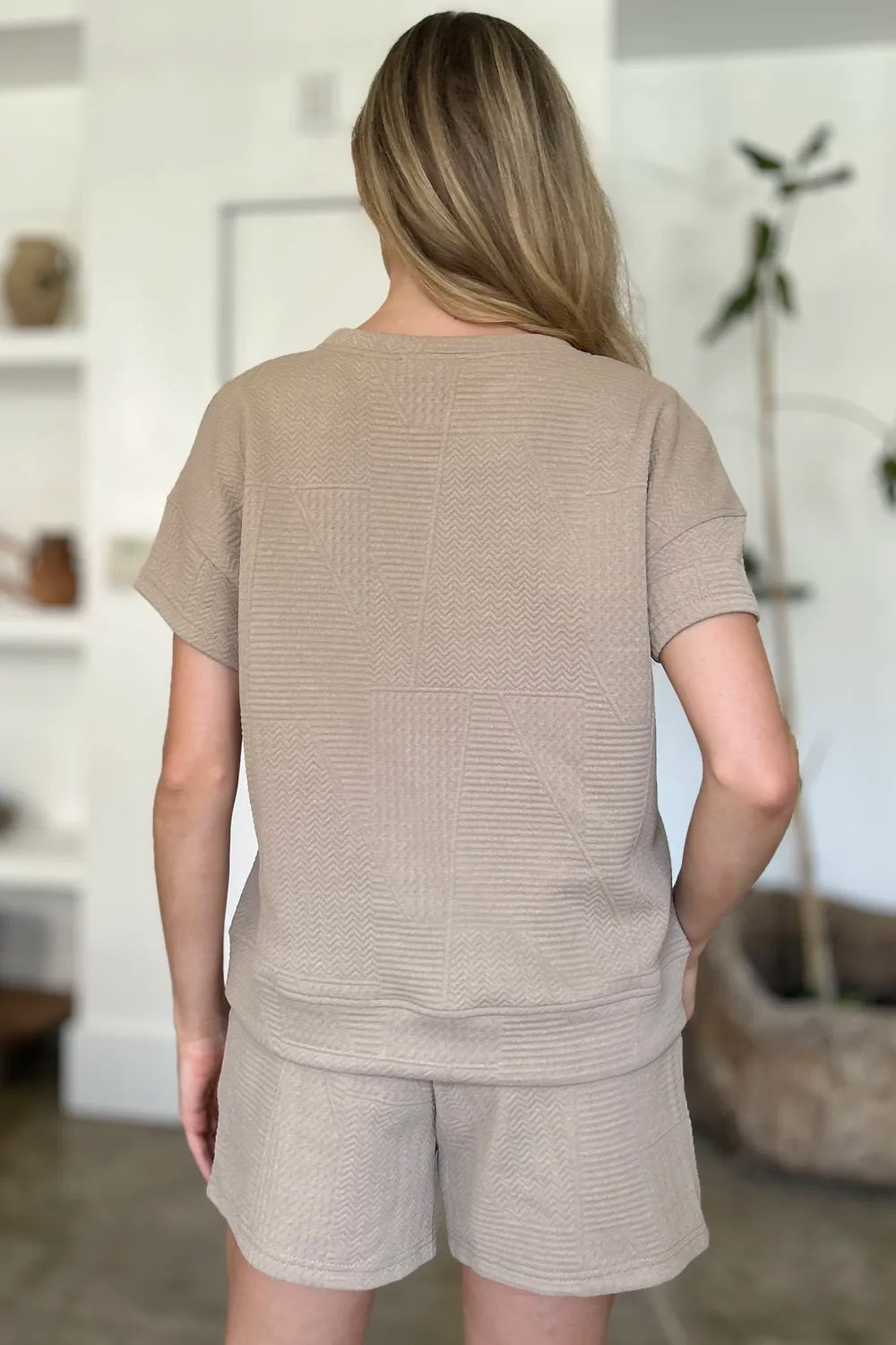 Back view: khaki textured short set with short-sleeve top and drawstring shorts