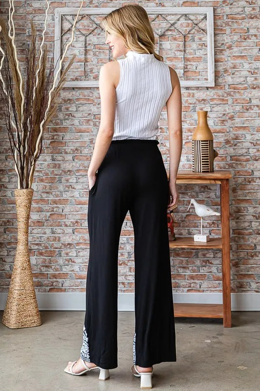 Black casual pants with damask border hem, wide-leg pull-on waist (back)